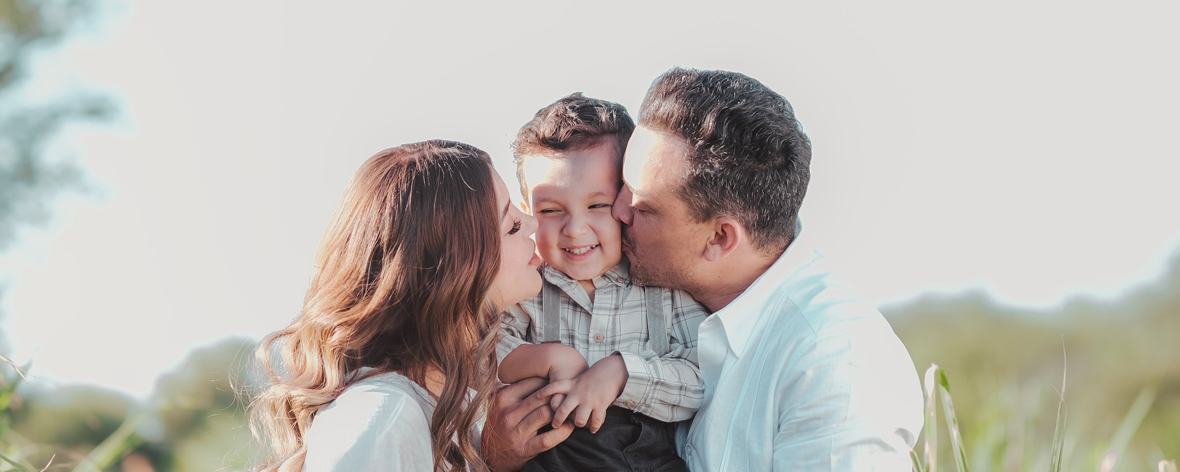 Family smiling with their baby