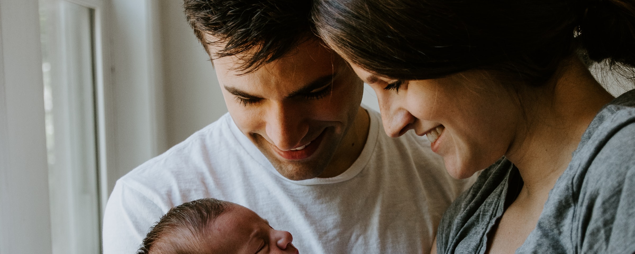 Parents holding their baby