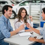 car dealer giving keys