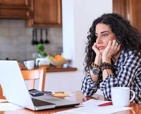 girl thinking at computer