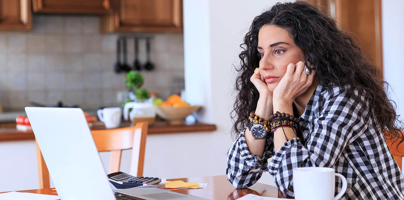 girl thinking at computer