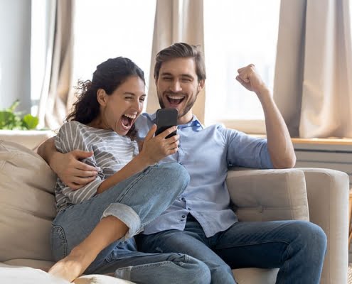 happy couple on couch