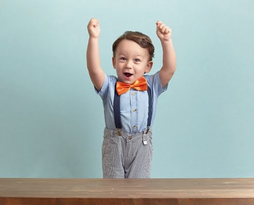 happy kid raising arms