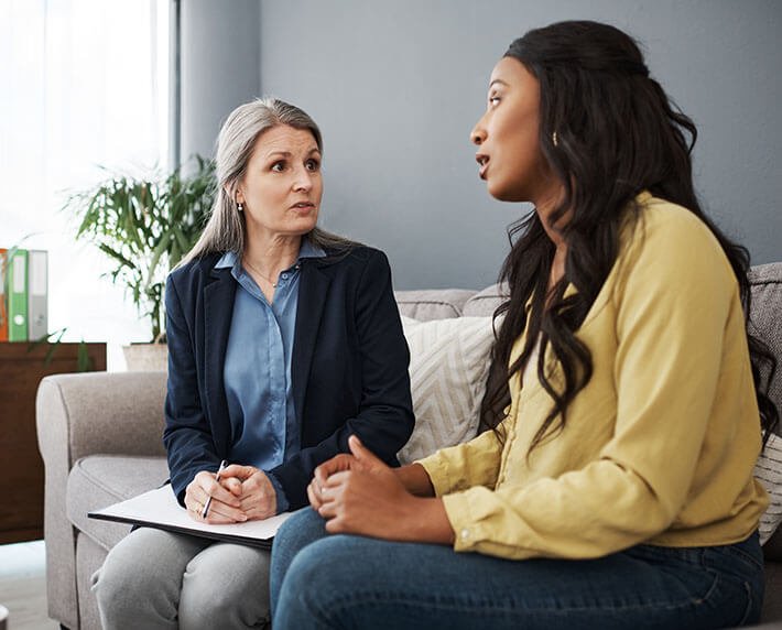 woman discussing investments with advisor